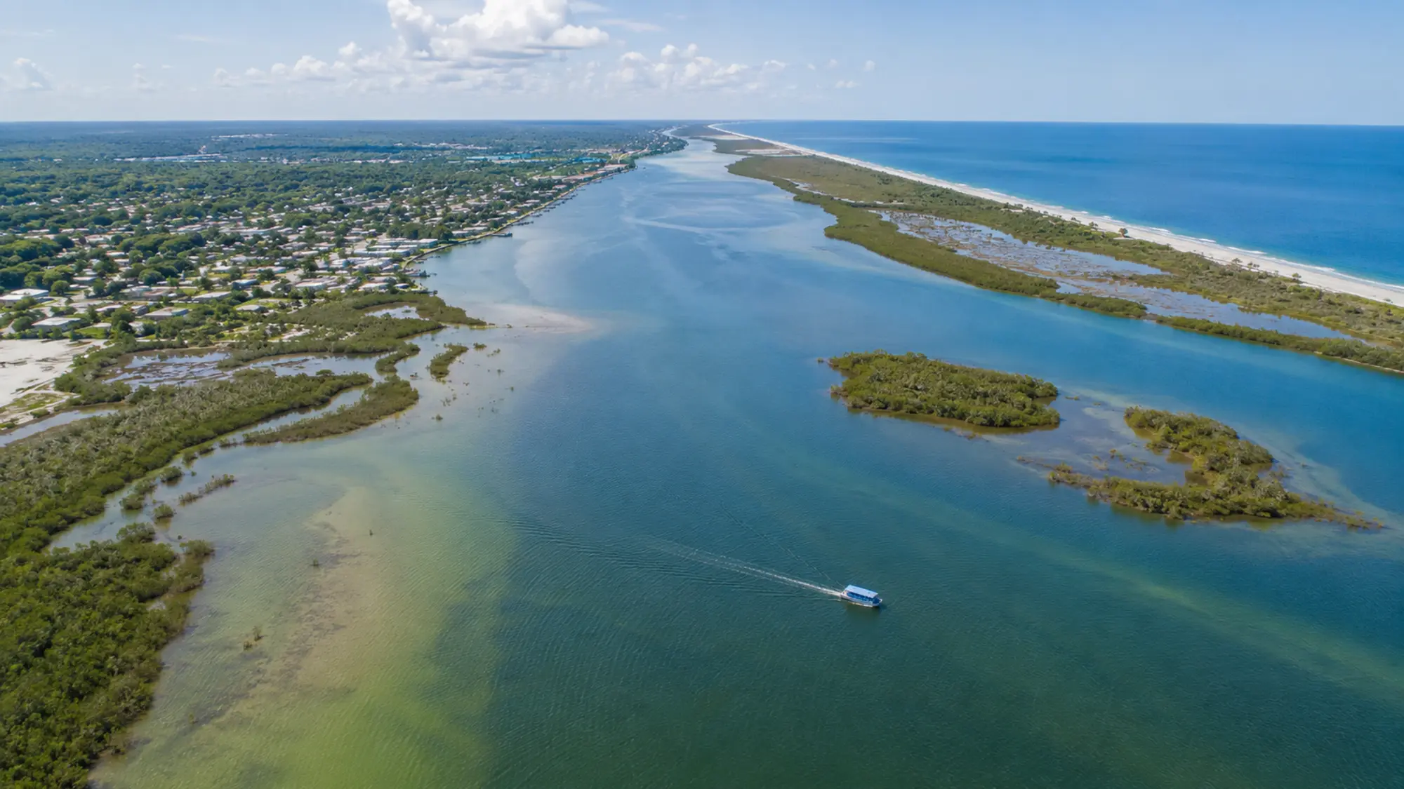 Aerial view of shallow coastal water and mangrove islands