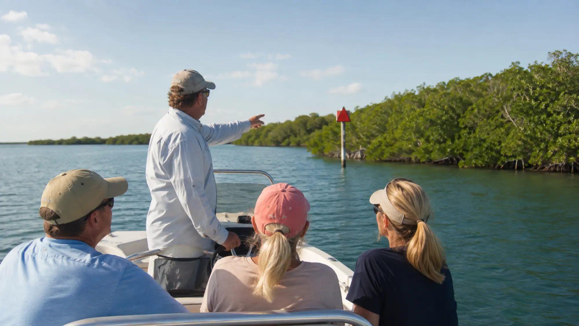 Small boat traveling through protected Lemon Bay water